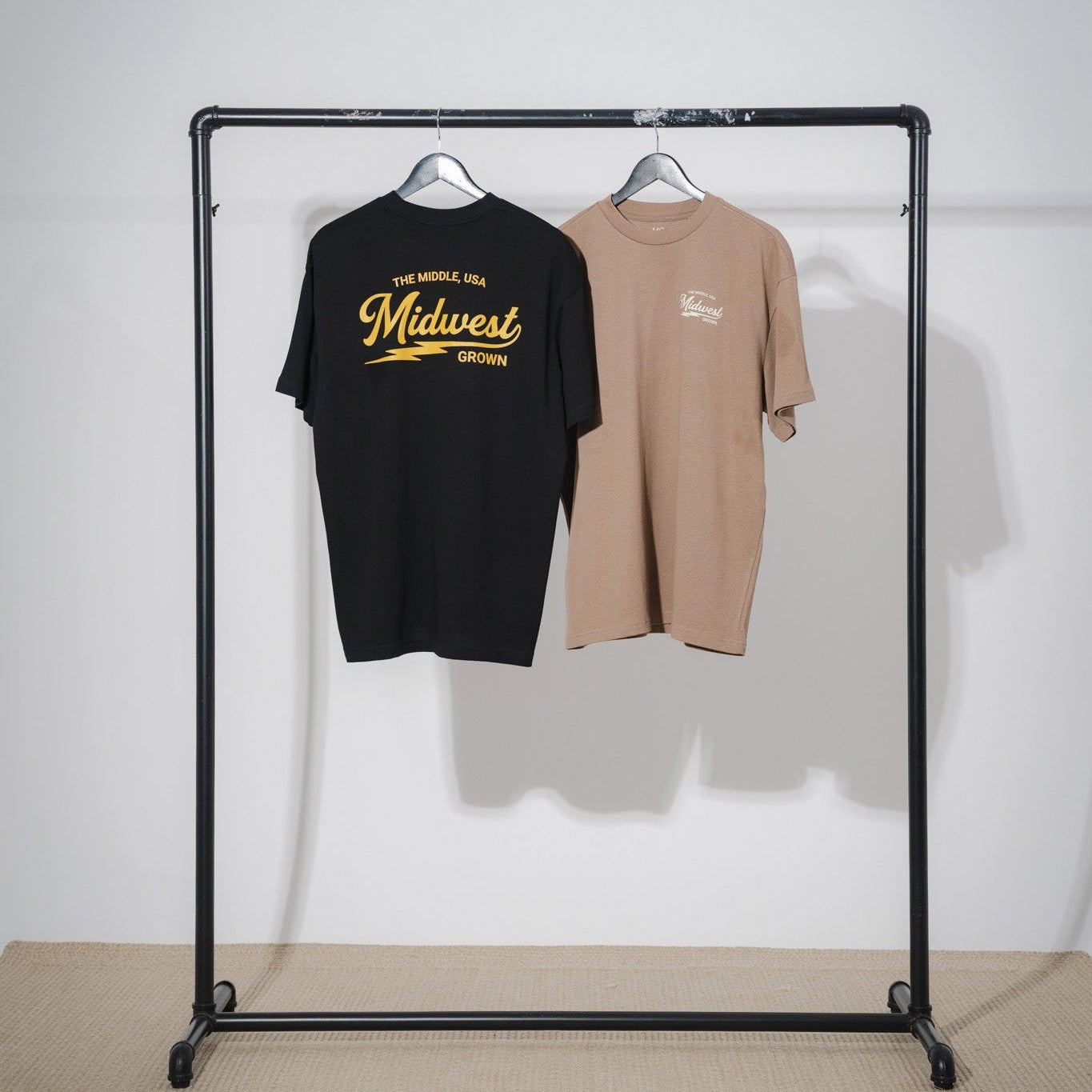 Black and walnut color t-shirt with 'Midwest' text from the brand midwest grown