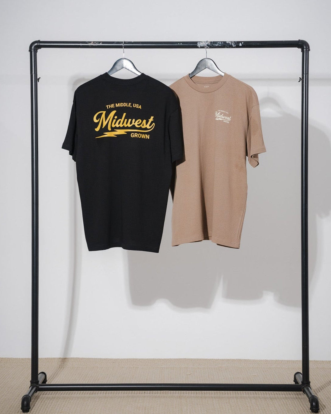 Black and walnut color t-shirt with 'Midwest' text from the brand midwest grown
